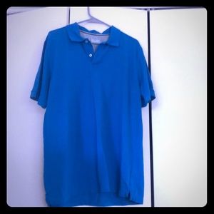 Blue polo shirt.